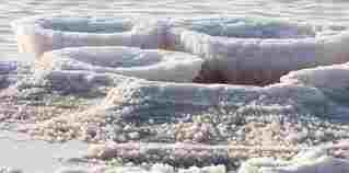 Tons of salt wait collection in "Ponds" at Ojo de Liebre," (Hare's Eye Lagoon) Baja, Mexico.