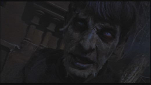 A zombie rises from the dead in Hammer's The Plague of the Zombies