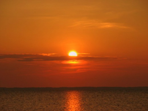 The sun sets over the beautiful Chesapeake Bay, just off of Saxis Island, Virginia. Saxis Island is located on the bayside of the Eastern Shore of Virginia.