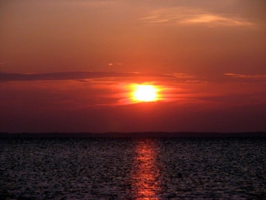 The sun sets over the beautiful Chesapeake Bay, just off of Saxis Island, Virginia. Saxis Island is located on the bayside of the Eastern Shore of Virginia.