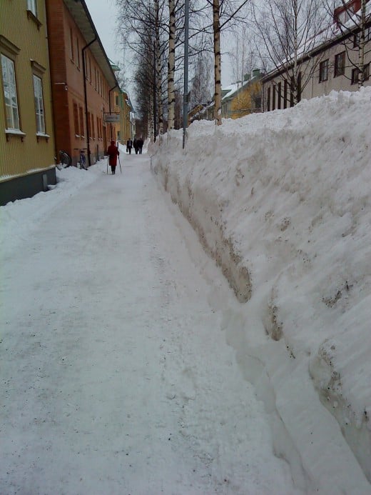 This is a photo from my visit to Umea, a city in  northen Sweden! Here they know what winter is all about! The driving way is on the other side of the mountain of snow!