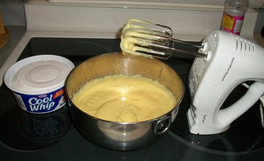 Beat instant vanilla pudding and milk until thick.