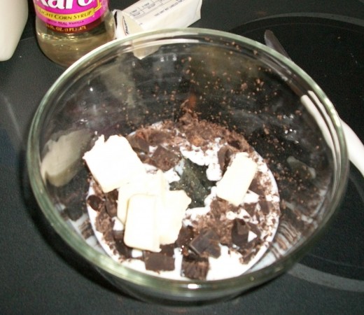 Put frosting ingredients (except powdered sugar) into a glass bowl and melt them in a microwave stove.