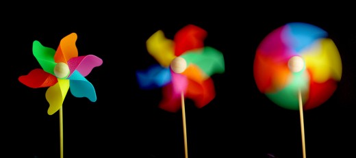 Shutter Speed.. in all three images, the pinwheel was spinning at about the same speed. The difference in the camera shutter speed causes different results.