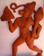 A picture of Hanuman holding an Indian Gada