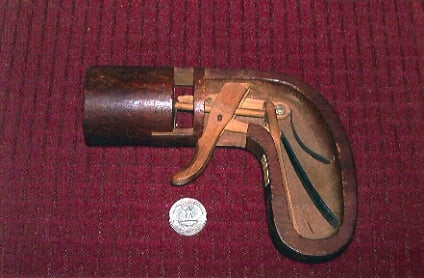 The wooden patent model for the original Leonard pistol shows the springs and trigger mechanism.