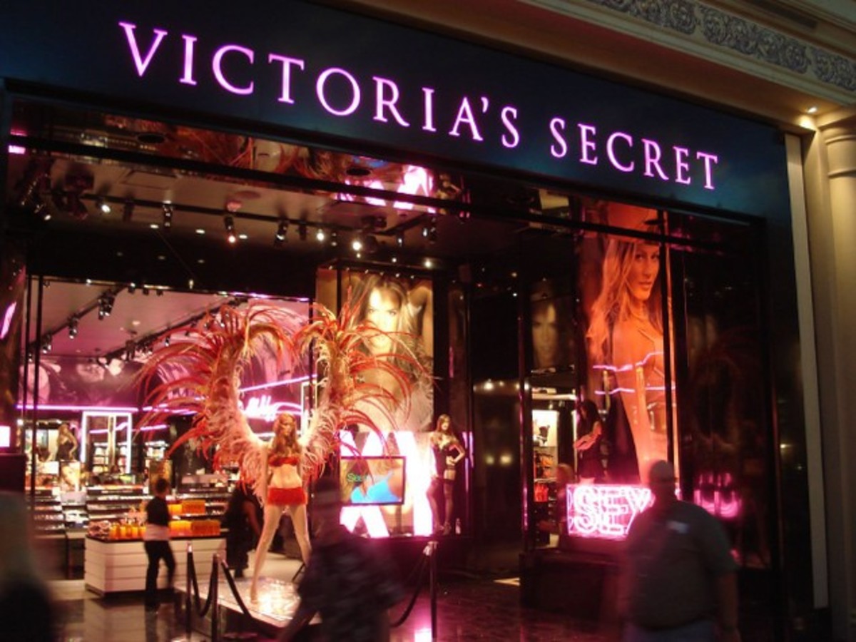 Victoria's Secret Store pictured on the outside. Can see an array of lingerie items and the glowing pink sign titled "Victoria's Secret"