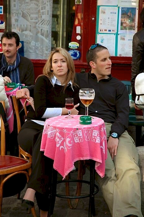 A pair of lovers 'enjoy' the Paris cafe scene.