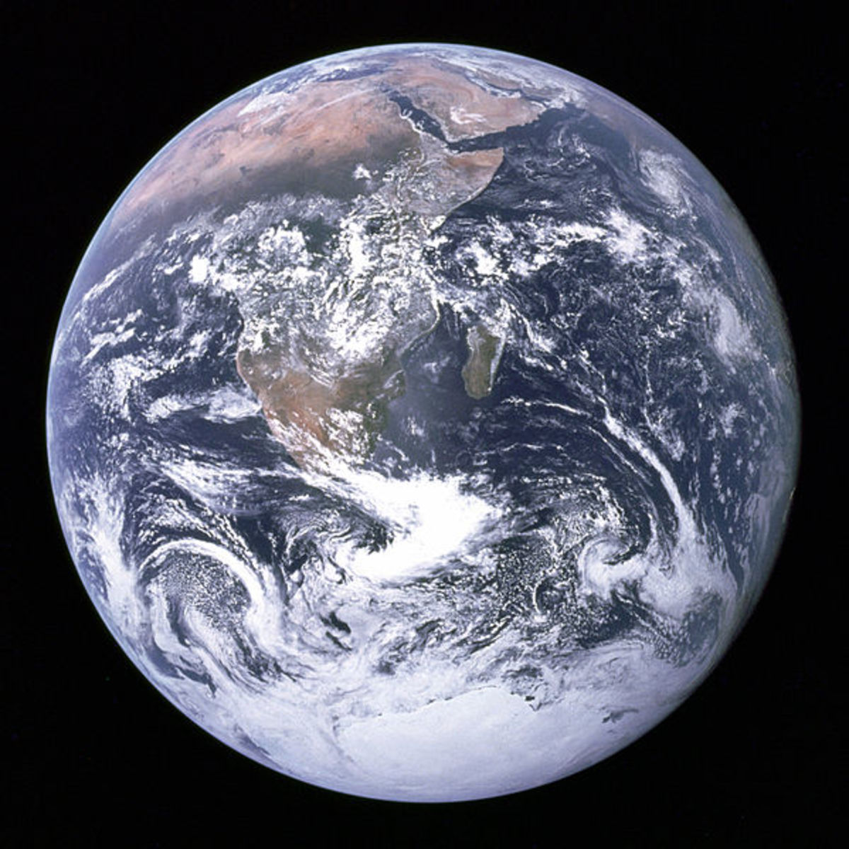 The "Blue Marble" photo, taken by Apollo 17 crew.  Water in solid and liquid form dominate the view.  (Clouds are mostly liquid water, but remind us of water vapor.)