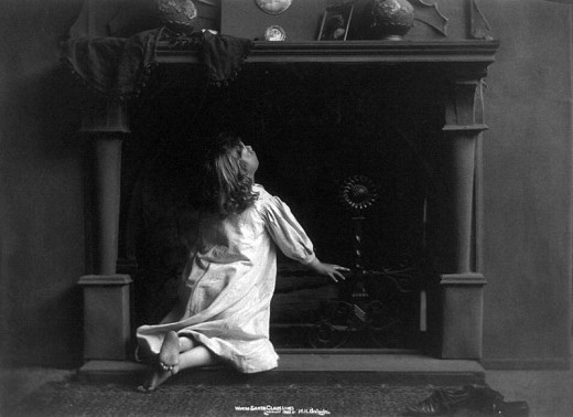 From the Library of Congress, c1900. Image of girl looking up the fireplace.