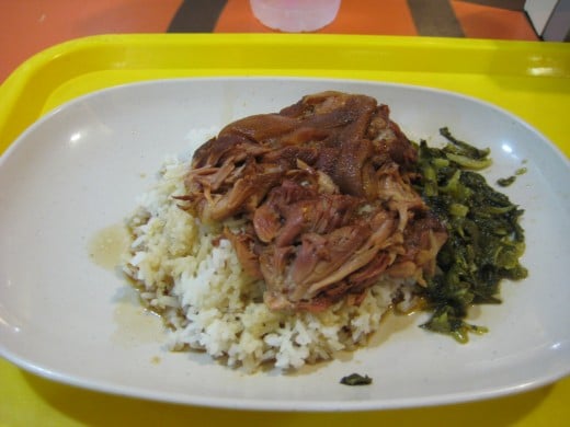 Stewed pork over rice with pickled cabbage