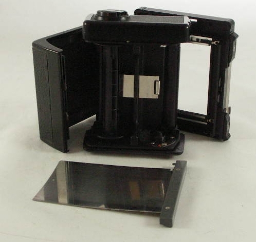 Medium format film has be hand loaded on the spools first...
