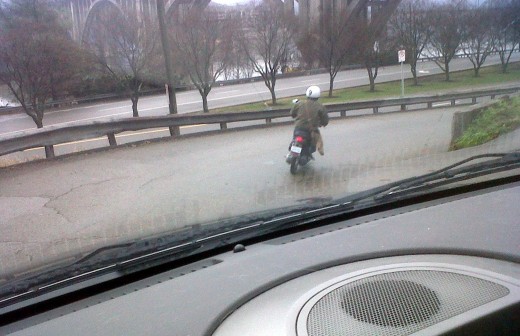 I find it quite embarrassing for a grown man to be seen in public riding a scooter, though this fellow did provide me with a laugh before work.