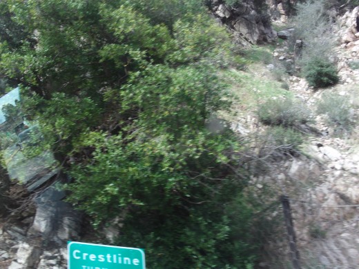 A picture of the top half of the Crestline sign on the way down Highway 18.  I was not trying to take a picture of the sign, but it ended up in one of the numerous photos I was taking from the backseat of the car.