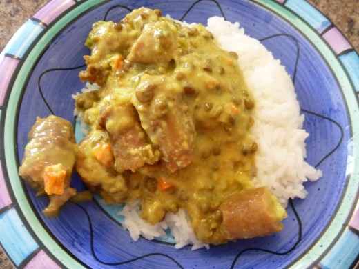 Swiftly prepared Curried Sausages - served on rice - in a funky dish 