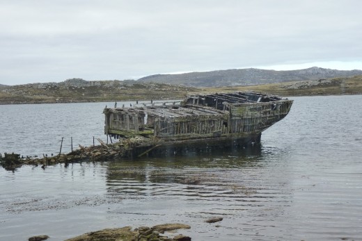 An old ship left rotting in the harbour.