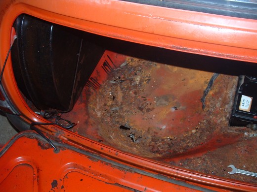 This whole spare wheel and battery box panel will have to be replaced