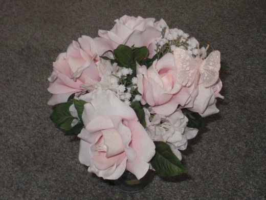 Try using artificial flowers for your wedding bouquet - they're beautiful, inexpensive, and they won't die