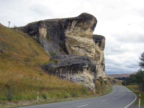 Frog Rock ! We used to watch out for him as kids! The Weka Pass between the northern end of the Canterbury Plains and the Amuri district has many weathered limestone outcrops. Their shapes sometimes suggest names  this one is known as Frog Rock. 