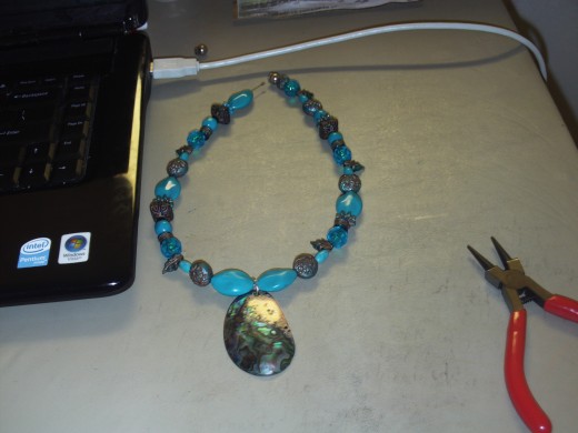 Add the rest of the beads to the other half of the necklace.