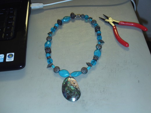 The necklace I made with the turquoise and silver hued mother of pearl shell.  It turned out quite nice actually.