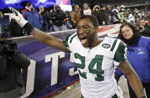 Darrelle Revis celebrates his team's 28-21 win over the New England Patriots in an NFL divisional playoff football game in Foxborough, Mass., Sunday, Jan. 16, 2011. (AP Photo/Winslow Townson)