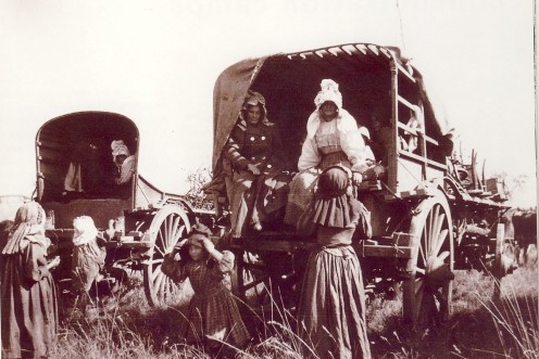 A Boer family being loaded onto wagons for transport to a concentration camp.  Image from "The Boer War" by David Smurthwaite (Hamlyn, 1999)