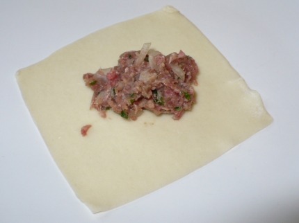 Place filling in the middle. You can use square dumpling skin or round ones.