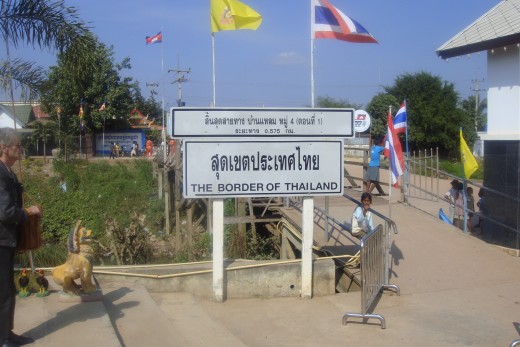 Baan Lem integration point. The yellow King's flag and red, white, blue Thai flag tells me I am still in Thailand. I left my passport at the Thai immigration window and carried the photo and copy of passport with me when I crossed over to Cambodia.