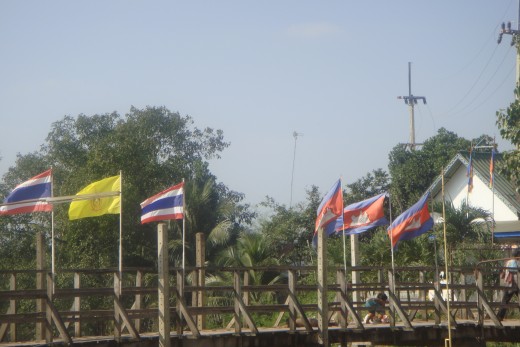 The Thai flags stopped and Cambodian flags began over the water and the bridge