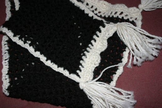 Black and white crochet scarf.
