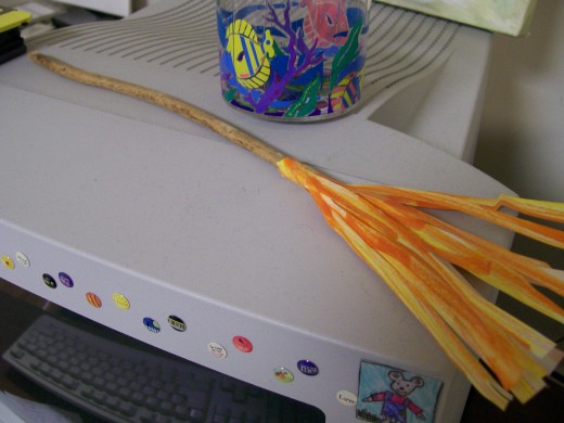 A homemade Firebolt still sits atop Mom's computer