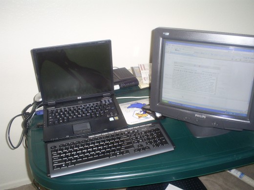 A picture of a the monitor, keyboard, and mouse that are hooked up to my laptop.