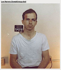 Oswald's mug shot the day of arrest. He told reporters the scrape above his left eye was because "a policeman hit me."