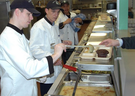 More US Navy feeding homeless at a Mission as part of an outreach program.