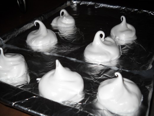 Meringue cookies going in the oven,
