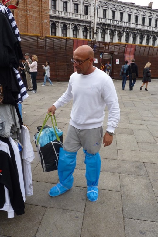 A merchant in Piazza San Marco ready for the water!
