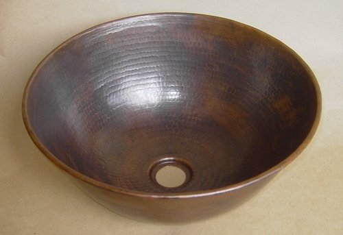 Copper vessel sinks are warm and beautiful and go with almost any decor.