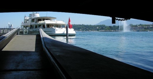 Unusual view of the water jet on Lake Geneva, from the pedestrian path under the Mont Blanc bridge