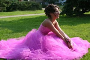 Amazon Prom Dresses - a picture of a beautiful, happy girl in a Pink Prom Dress in the green grass