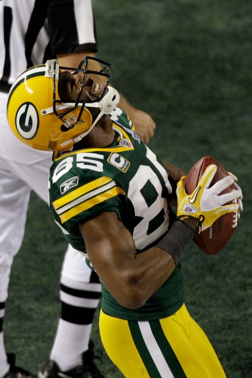 FEBRUARY 06: Greg Jennings(notes) #85 of the Green Bay Packers celebrates scoring a fourth quarter touchdown against the Pittsburgh Steelers during Super Bowl XLV at Cowboys Stadium on February 6, 2011 in Arlington, Texas. (Photo by Rob Carr/Getty Im