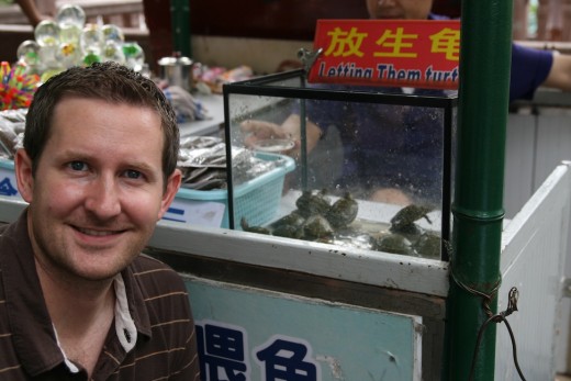 Here I am with some turtles for sale at a market in Beijing. I think they were baby sliders.