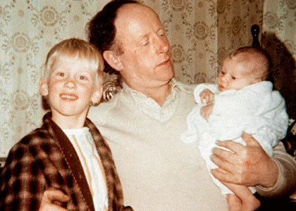 Bryant as a boy with his father and baby sister