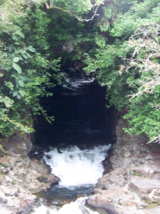 Gorgeous cave in the mountain flowing with spring water.
