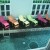I think these colourful deck chairs add a delightful accent to the room. Image: New Majestic Hotel