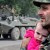 Dmitry Kostyukov AFP/Getty Image A South Ossetian military man holds a child as he looks at an armored vehicle in the village of Dzhava, South Ossetia, Georgia. Dmitry Kostyukov AFP/Getty Image A South Ossetian military man holds a child as he looks at an armored vehicle in the village of Dzhava, South Ossetia, Georgia.