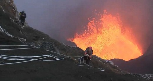 Volcano lava: A climber begins lowers himself 500 metres down steep rocks towards the intense heat of Marum volcano