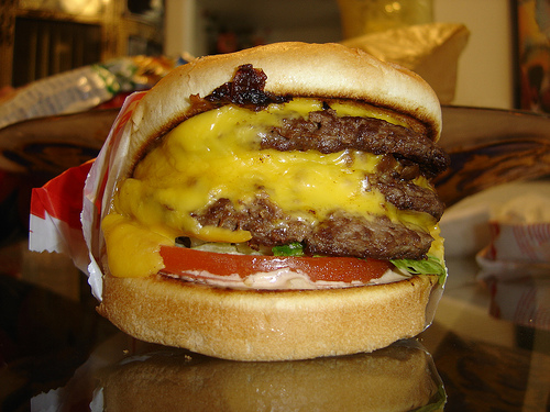 3 patty's with 3 mouth watering slices of cheese