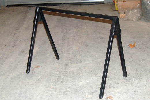 I completed one of my sawhorses today.  I added some end-caps and sprayed a light coat of bedliner to her.  I'm willing to bet this thing won't stay pretty for long.