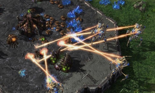This is a screenshot from Starcraft 2, showing one player's mining operations being attacked by his opponent.